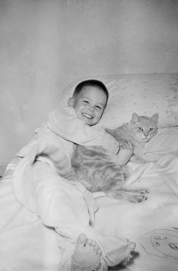 In 1958, at age 5, Dick Goben and his cat China get used to their new surroundings in Coronado.